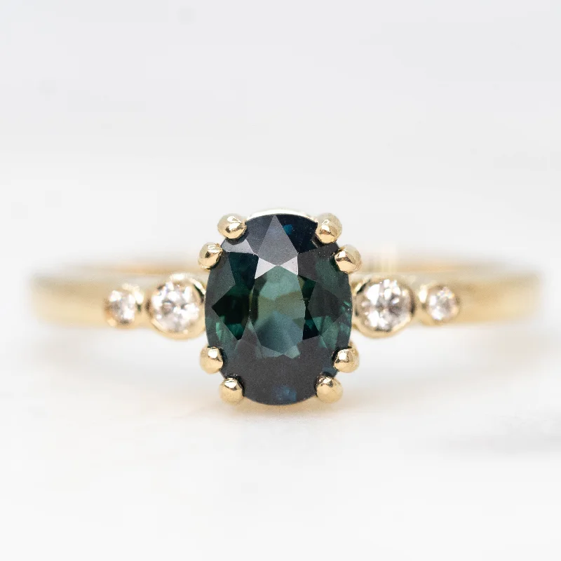 women's engagement rings with twisted band detail -Joyce Ring with a 1.21 Carat Oval Teal Sapphire and White Diamond Accents in 14k Yellow Gold - Ready to Size and Ship