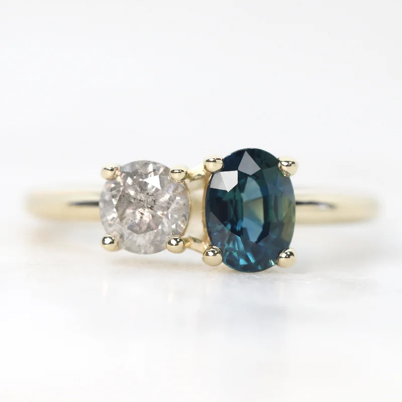 women's engagement rings with minimalistic elegance -Toi et Moi Ring with a 0.58 Light Gray Round Salt and Pepper Diamond and a 1.11 Carat Teal Blue Oval Sapphire in 14k Yellow Gold - Ready to Size and Ship